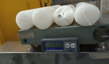 Aseguraron en Querétaro cargamento de crystal oculto en veladoras con doble fondo