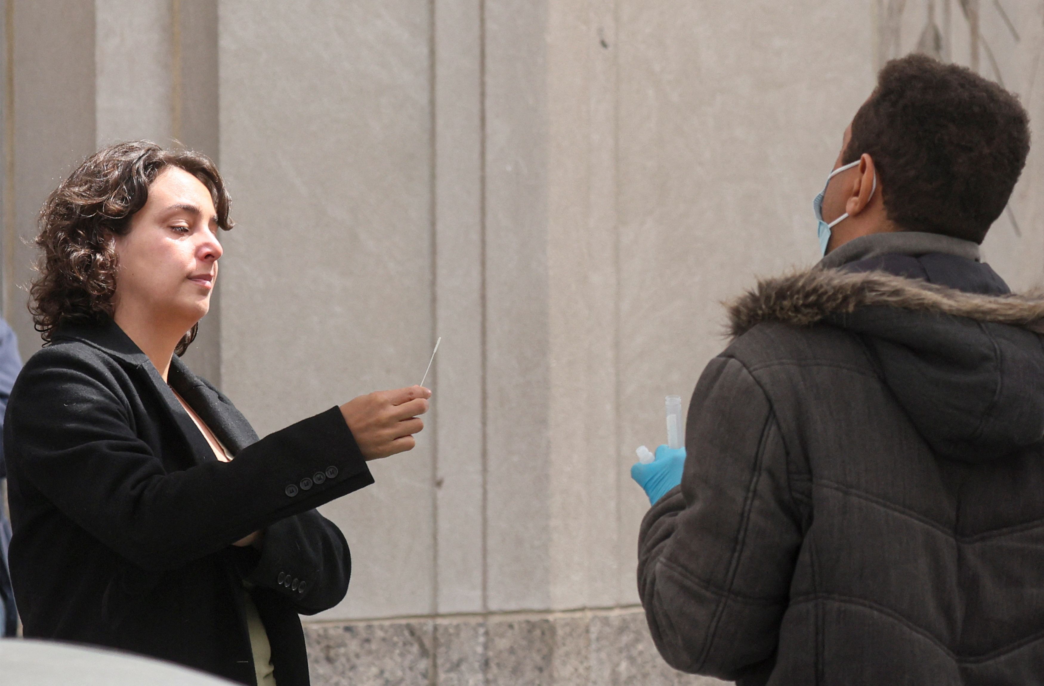 A woman takes a coronavirus disease (COVID-19) test at a pop-up testing site in New York City, U.S., May 3, 2022. REUTERS/Brendan McDermid
