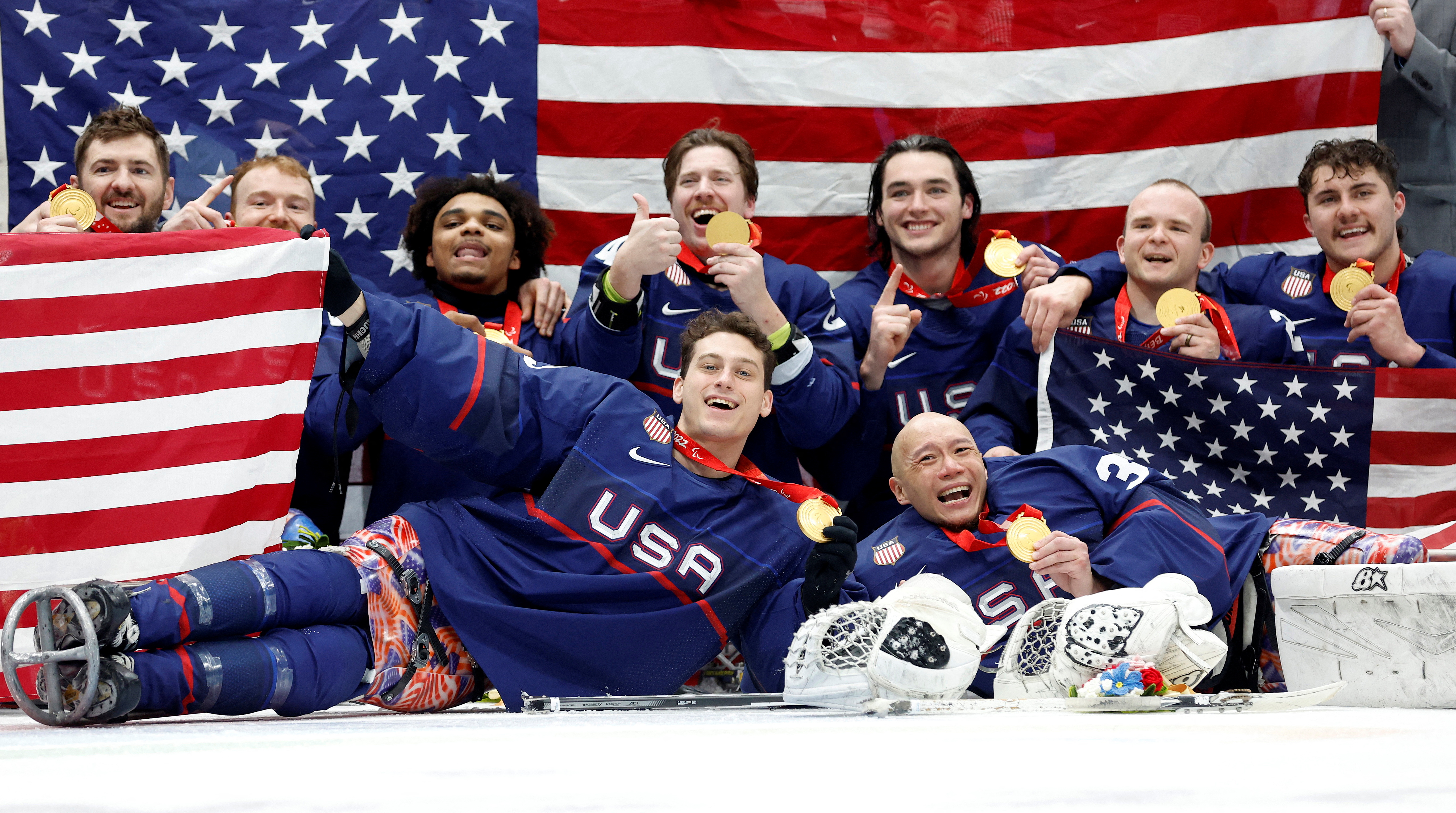 Beijing 2022 Winter Paralympic Games - Para Ice Hockey - Gold Medal Match - United States v Canada - National Indoor Stadium, Beijing, China - March 13, 2022. Gold medallists team United States players pose during the medal ceremony. REUTERS/Peter Cziborra TPX IMAGES OF THE DAY