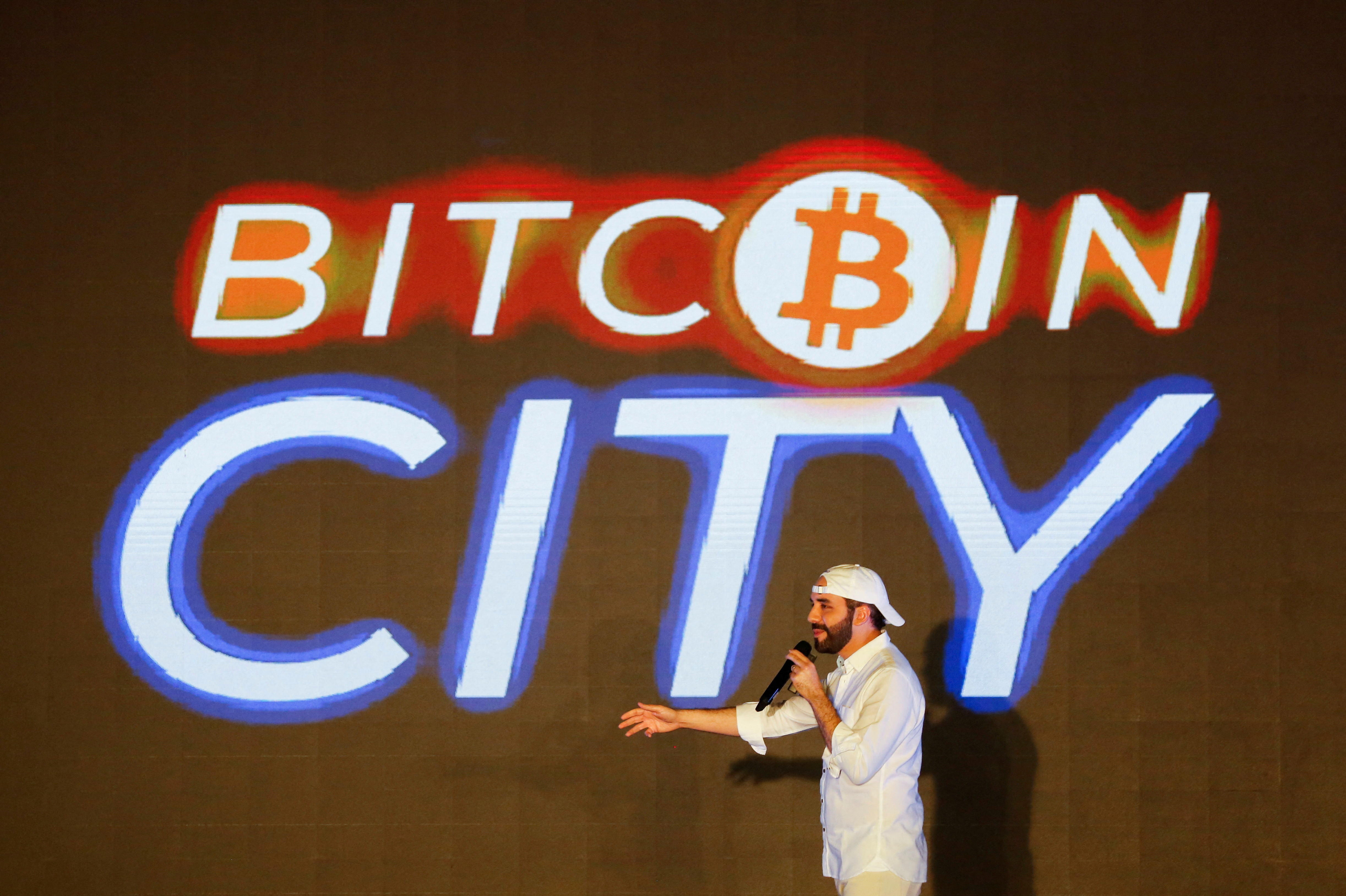 FILE PHOTO: El Salvador’s president Nayib Bukele speaks at the closing party of the “Bitcoin Week” where he announced the plan to build the first “Bitcoin City” in the world, in Teotepeque, El Salvador November 20, 2021. REUTERS/Jose Cabezas/File Photo