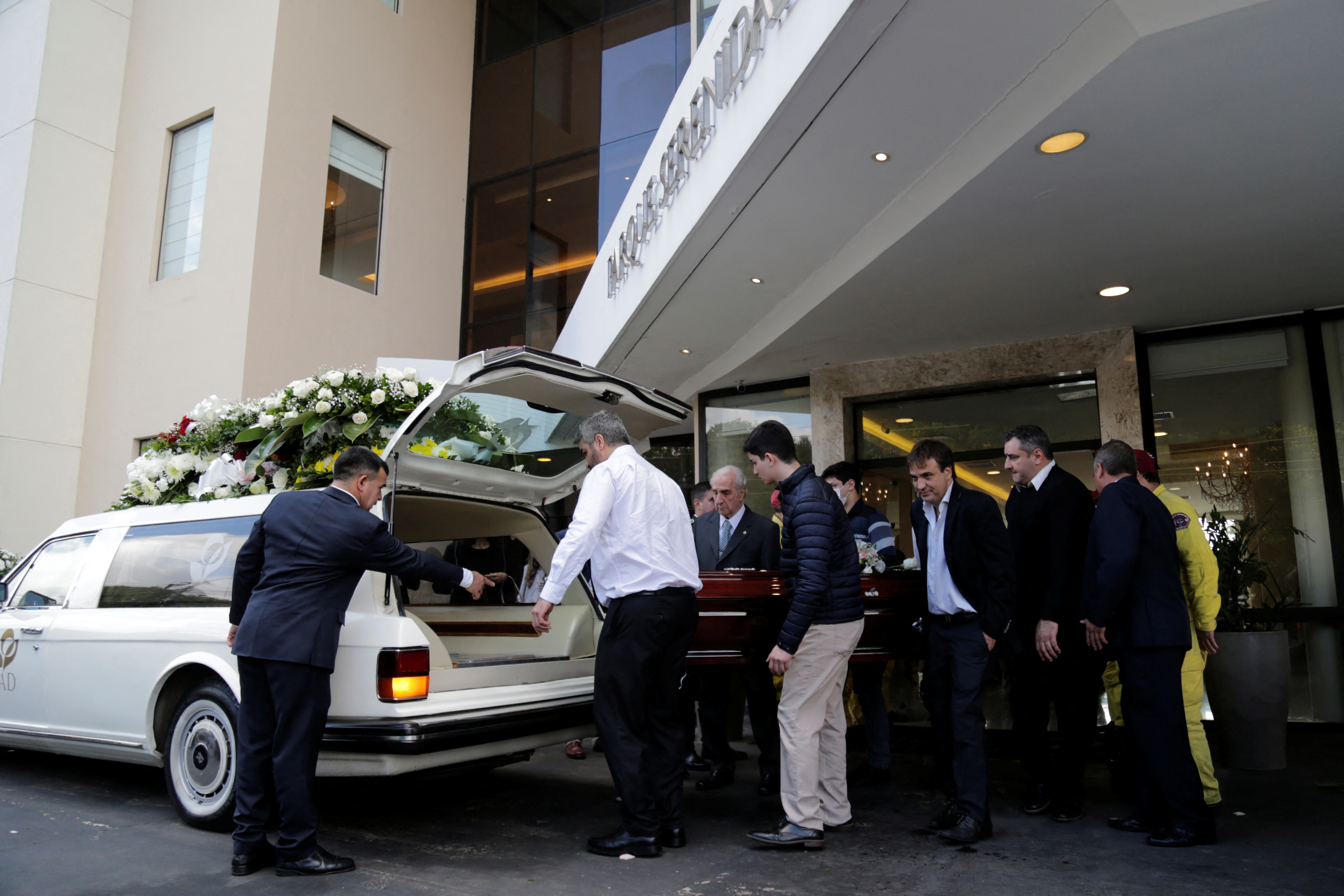 Relatives and friends carry the coffin holding the body of prosecutor Marcelo Pecci, who was shot dead in his honeymoon on the island of Baru in Colombia on Tuesday, during his funeral in Asuncion, Paraguay May 15, 2022. REUTERS/Cesar Olmedo