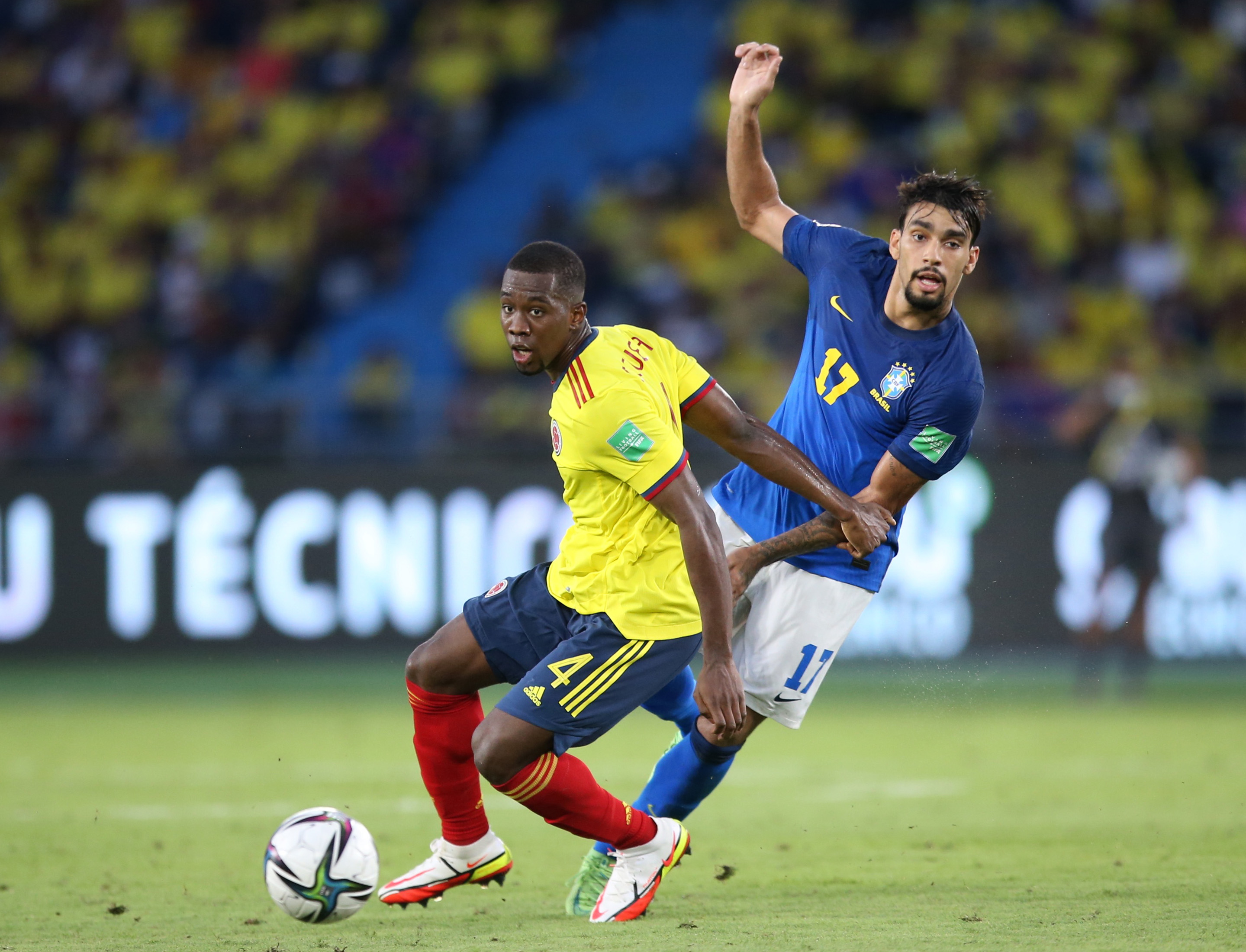 Soccer Football - World Cup - South American Qualifiers - Colombia v Brazil - Estadio Metropolitano Roberto Melendez, Barranquilla, Colombia - October 10, 2021 Colombia's Carlos Cuesta in action with Brazil's Lucas Paqueta REUTERS/Luisa Gonzalez