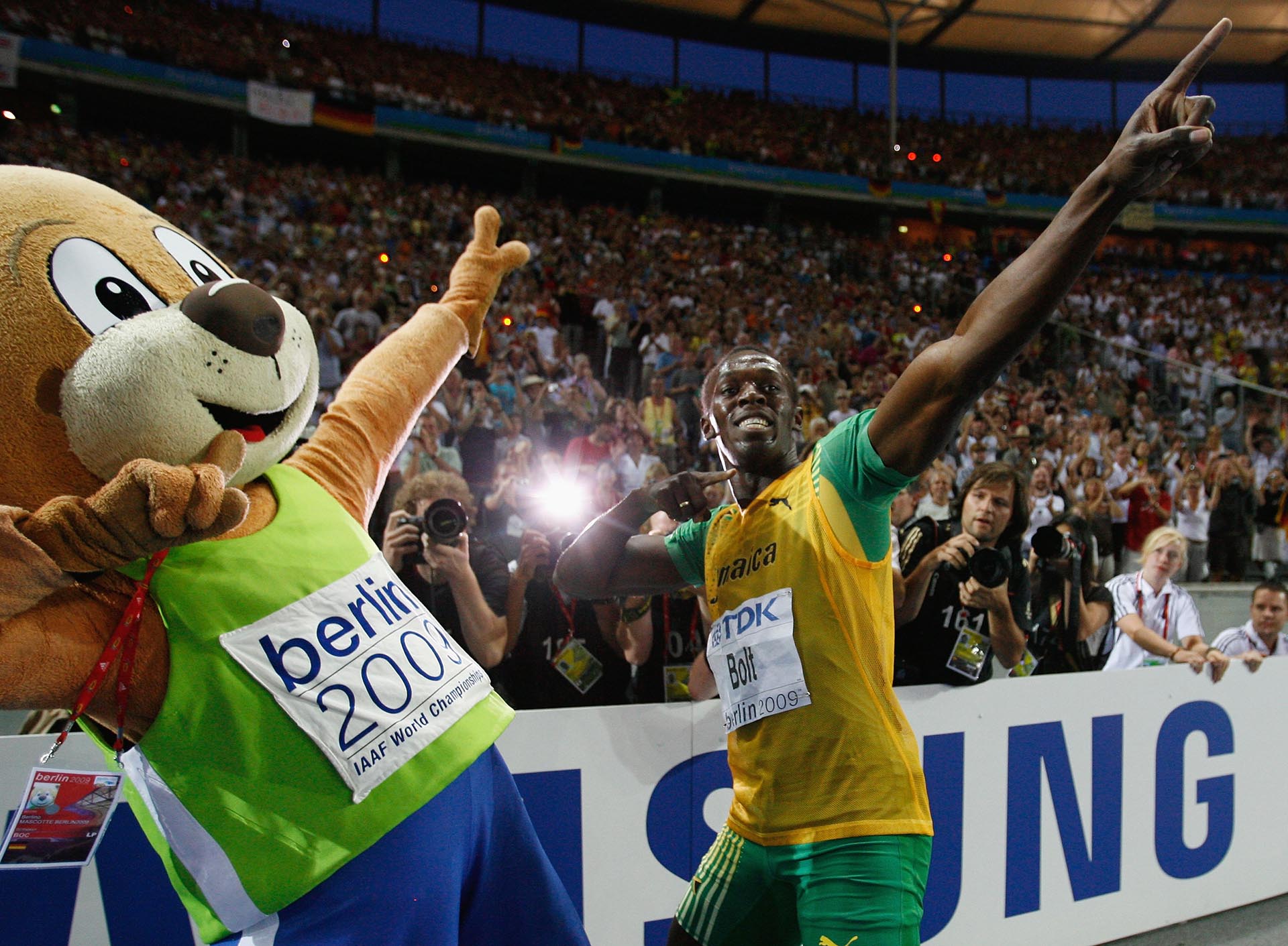 BERLIN - AUGUST 20: Usain Bolt of Jamaica celebrates winning the gold medal in the men's 200 Metres Final during day six of the 12th IAAF World Athletics Championships at the Olympic Stadium on August 20, 2009 in Berlin, Germany. Bolt set a new World Record of 19.19 seconds. (Photo by Andy Lyons/Getty Images)